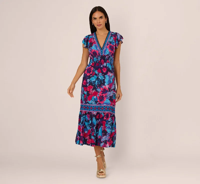 Elegant spring dresses for a wedding guest look -Bright Floral Print Midi Dress With Flutter Sleeves In Navy Pink Multi