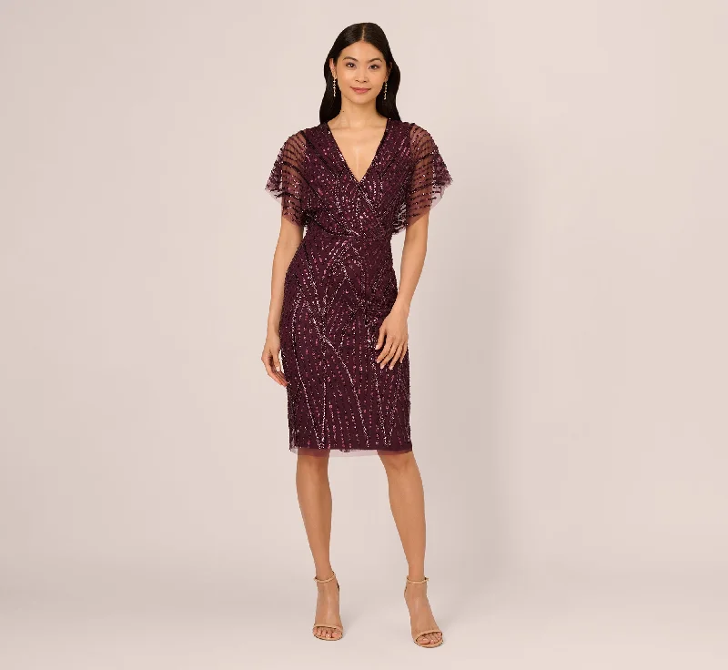Trendy wedding guest dresses for a cocktail party reception -Beaded Surplice Midi Dress With Dolman Sleeves In Deep Amethyst
