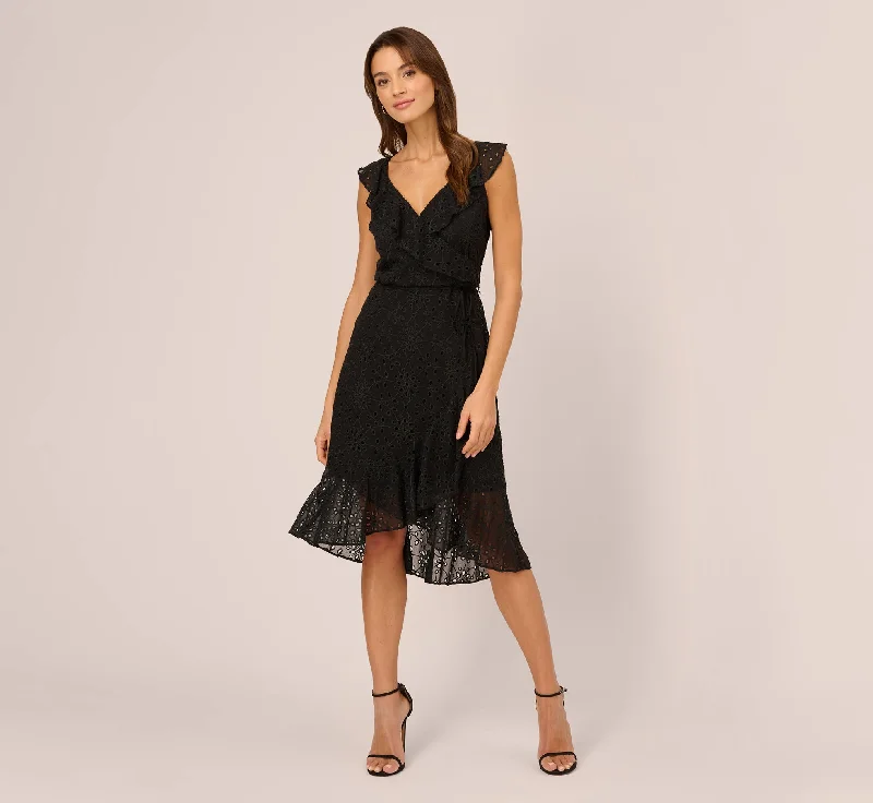 Wedding guest dresses with halter necklines for added style -Eyelet Faux Wrap Midi Dress With Ruffle Details In Black
