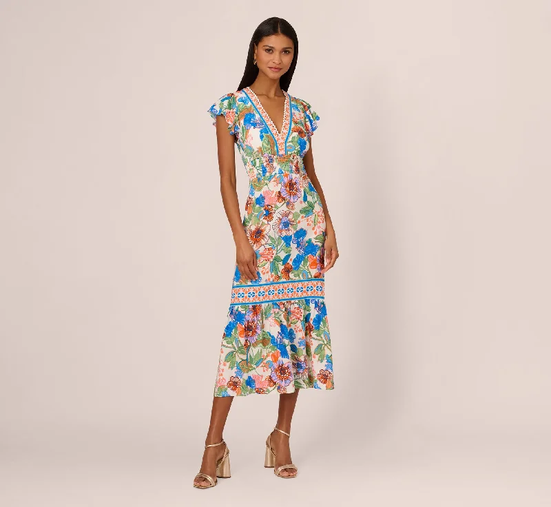 Elegant spring dresses for an outdoor evening event -Bright Floral Print Midi Dress With Flutter Sleeves In Blue-Green Multi